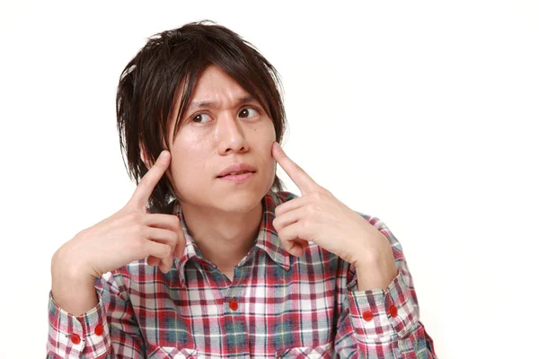 Fiatal japán ember aggódik valami — Stock Fotó