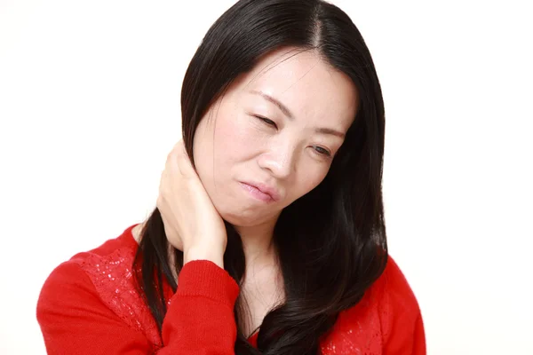 Japanese woman suffers from neck ache — Stock Photo, Image