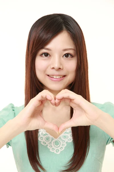 Japanese woman with heart — Stock Photo, Image