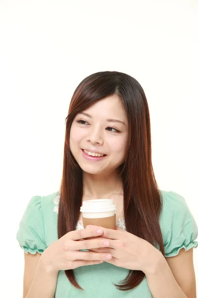 Japanese woman takes a coffee break — Stock Photo, Image