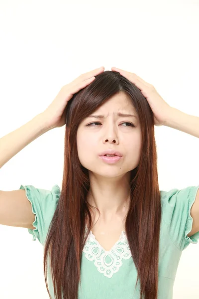 Perplexed young Japanese woman — Stock Photo, Image