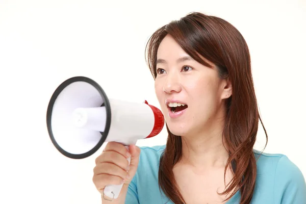 Middle aged Japanese woman with megaphone — Stock Photo, Image