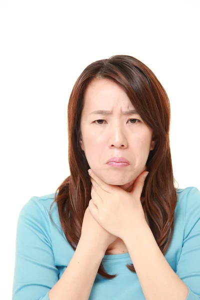 Middle aged Japanese woman having throat pain — Stock Photo, Image