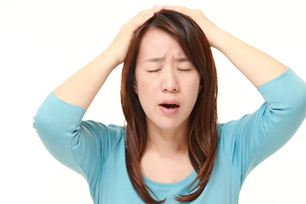 Middle aged Japanese woman perplexed — Stock Photo, Image