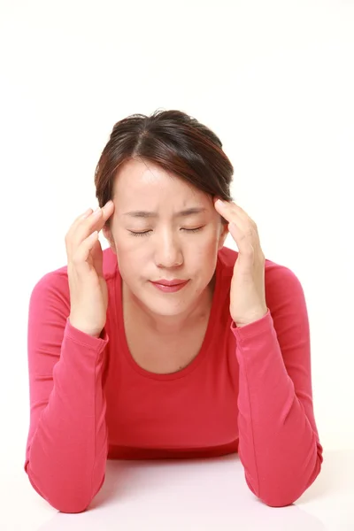 Woman suffers from headache — Stock Photo, Image