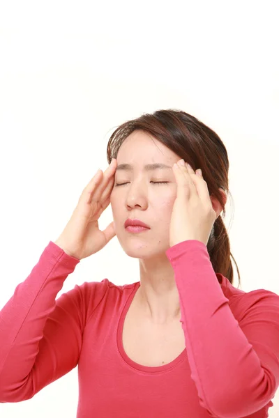 Woman suffers from headache — Stock Photo, Image