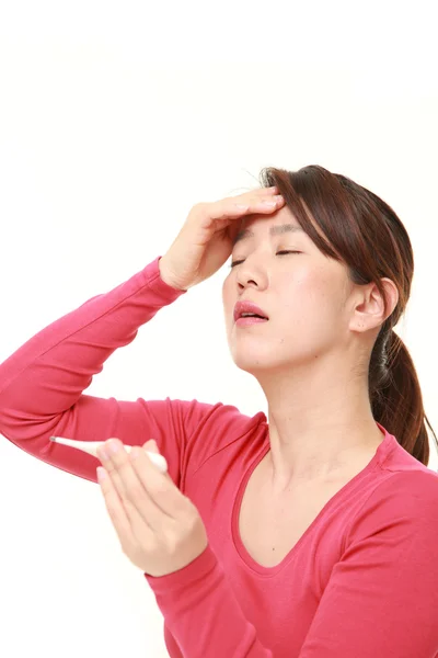 Middle aged Japanese woman with fever — Stock Photo, Image