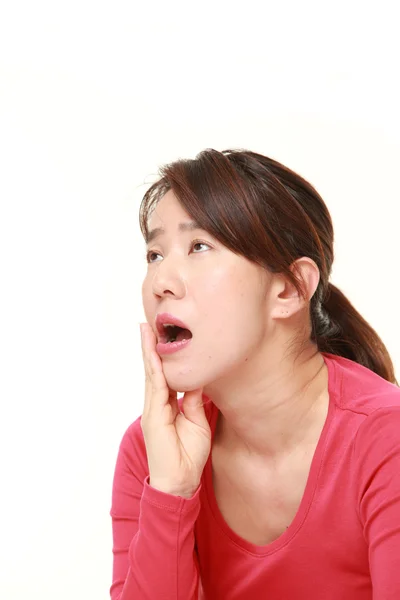 Middle aged Japanese woman suffers from toothache — Stock Photo, Image