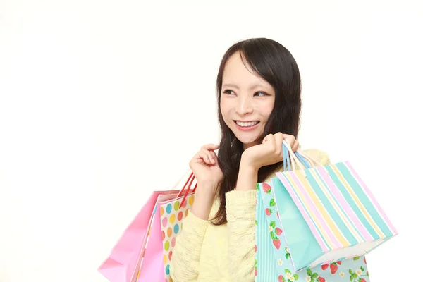 Japansk kvinna med kassar och påsar — Stockfoto