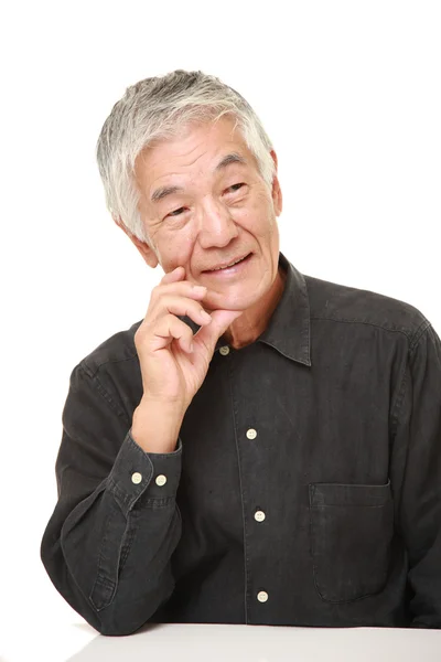 Senior Japanese man thinks about something — Stock Photo, Image