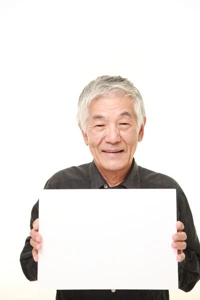 Sênior japonês homem com mensagem bordo — Fotografia de Stock