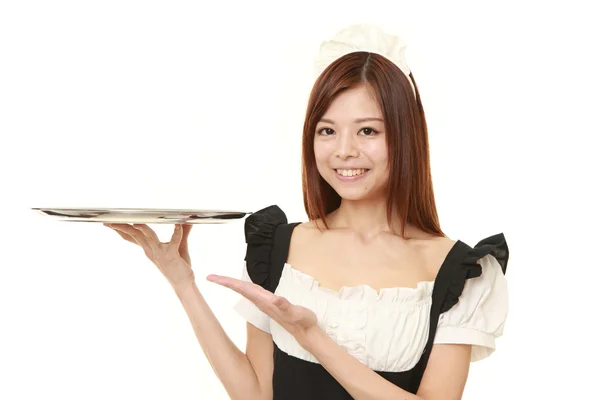 Joven japonesa mujer vistiendo francés sirvienta traje con bandeja —  Fotos de Stock