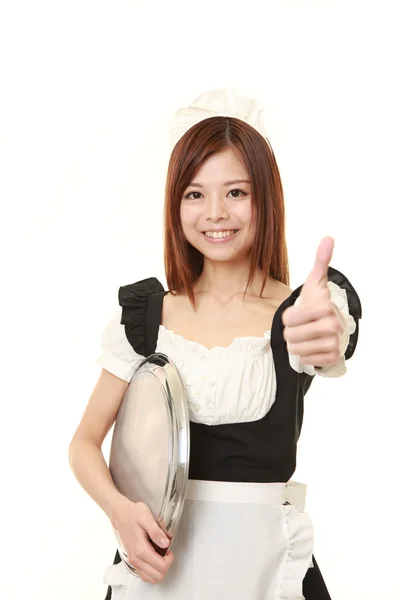 Jovem japonês mulher vestindo francês empregada fantasia com polegares até gesto — Fotografia de Stock