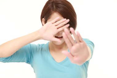 young Japanese woman making stop gesture clipart