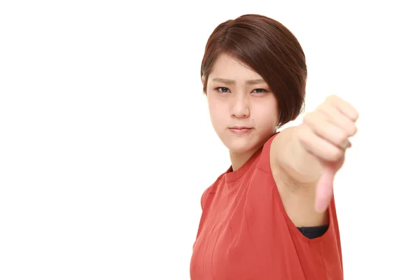 Mladá Japonka s palec dolů gesto — Stock fotografie
