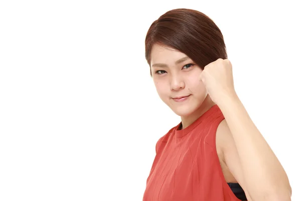 Unga japanska kvinnan i en seger innebära — Stockfoto