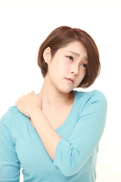 Fiatal japán nő szenved, nyak fájdalom enyhítésére — Stock Fotó