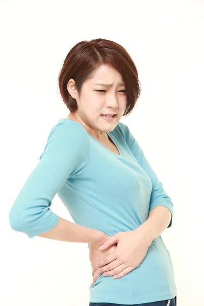 Japonesa mujer sufre de lumbago — Foto de Stock