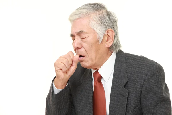 Senior Japanese businessman coughing — Stock Photo, Image