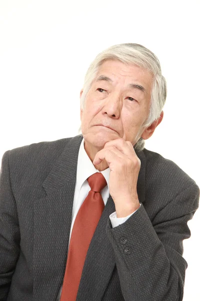 Senior Japanese businessman worries about something — Stock Photo, Image