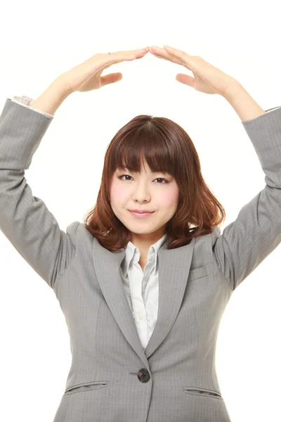 Japanese businesswoman showing OK gesture — Stock Photo, Image