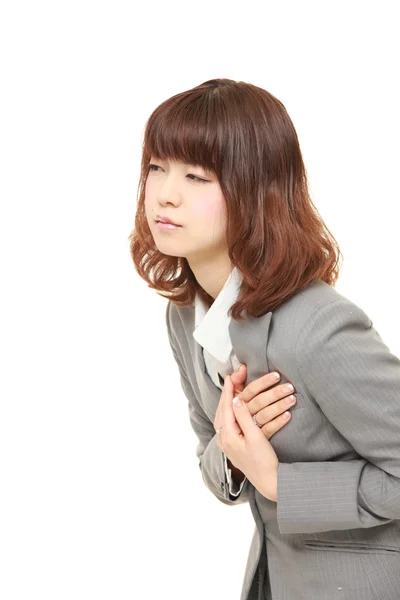 Молодой японский бизнесмен страдает от рака груди — стоковое фото