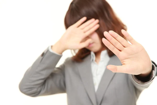 Joven japonesa mujer de negocios haciendo stop gesture —  Fotos de Stock