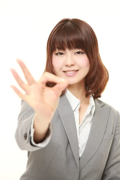 Young Japanese business woman showing perfect sign — Stock Photo, Image