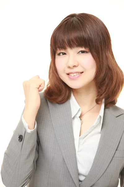 Joven mujer de negocios japonesa en una pose de victoria — Foto de Stock