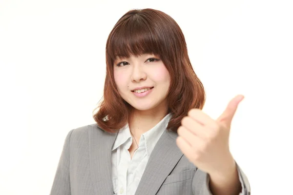 Giovane donna d'affari giapponese con i pollici in su gesto — Foto Stock