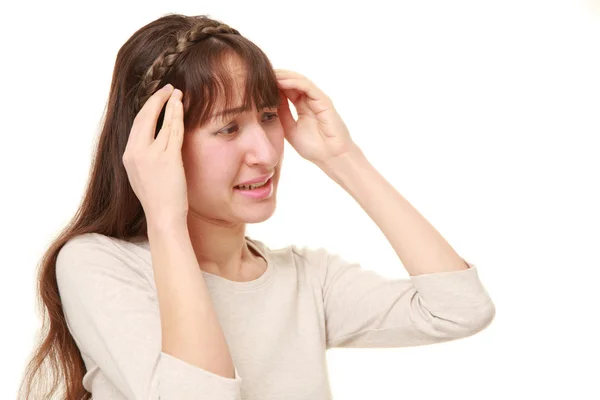 Young woman suffers from headache — Stock Photo, Image