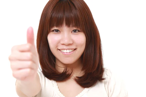 Νέα ιαπωνική γυναίκα με μπράβο χειρονομία — Φωτογραφία Αρχείου
