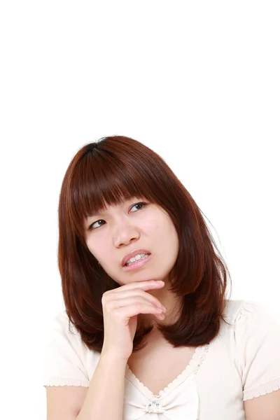 Młoda kobieta japoński martwi się o coś — Zdjęcie stockowe