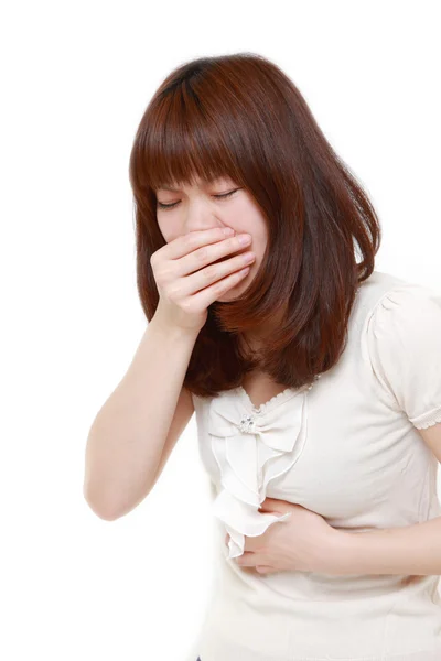 Japanse vrouw voelt braken — Stockfoto