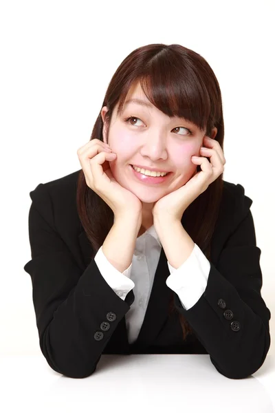 Young Japanese businesswoman dreaming at her future — Stock Photo, Image