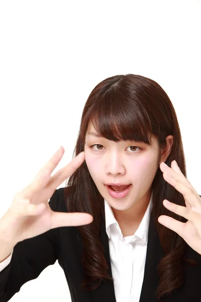 Jonge Japanse zakenvrouw met bovennatuurlijke kracht — Stockfoto