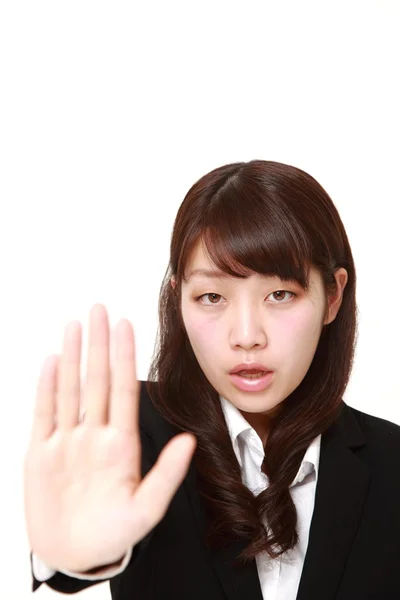 Joven japonesa mujer de negocios haciendo stop gesture —  Fotos de Stock