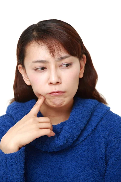 Asian woman worries about something — Stock Photo, Image