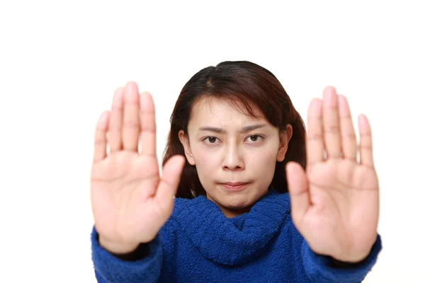 Asian woman making stop gesture — Stock Photo, Image