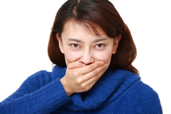 Asian woman making the speak no evil gesture — Stock Photo, Image