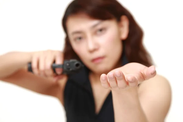 Female robber with a handgun — Stock Photo, Image