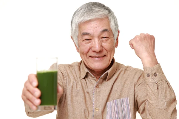 Senior Japanese man with green vegetable juice — Stock Photo, Image