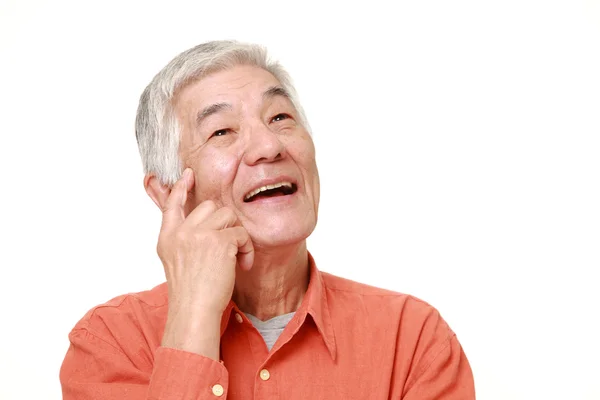 Senior japonés hombre soñando en su futuro —  Fotos de Stock