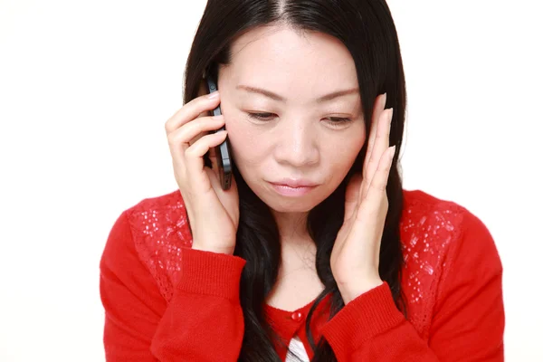 Japanese woman receiving bad news — Stock Photo, Image