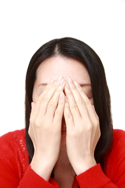 Woman covering her face with hands — Stock Photo, Image