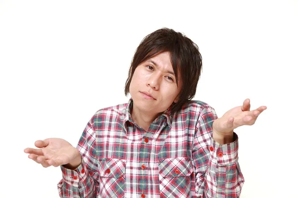 Young Japanese man confused — Stock Photo, Image