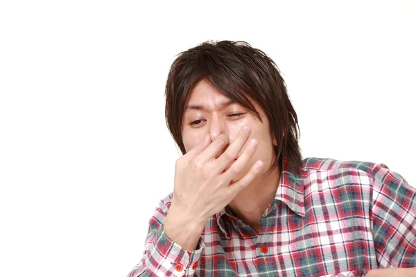 Japanse man die met zijn neus vanwege een slechte geur — Stockfoto