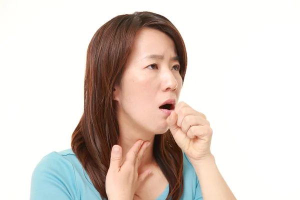 Mulher japonesa de meia idade tosse — Fotografia de Stock