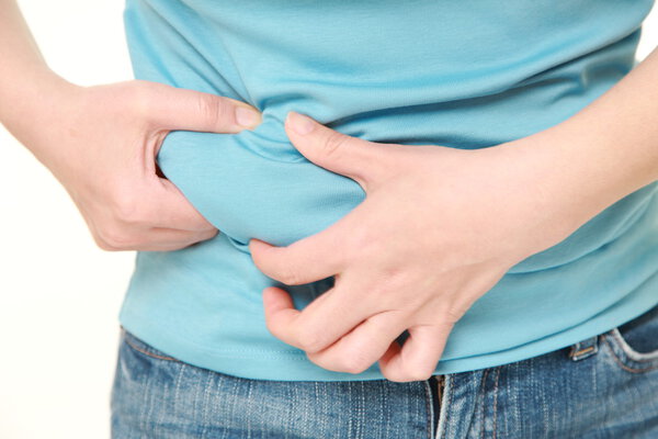 woman pinching belly fat