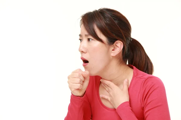 Middle aged Japanese woman coughing — Stock Photo, Image